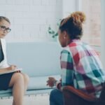 Therapist listens to patient in a counseling session