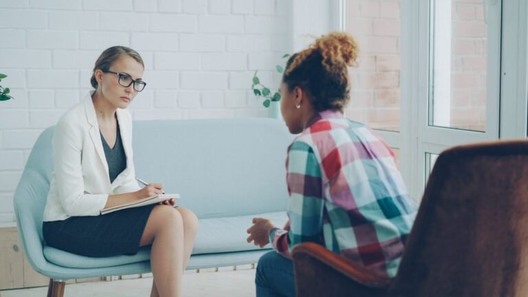 Therapist listens to patient in a counseling session