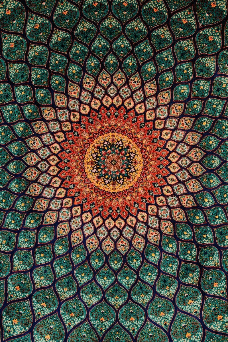 Intricate persian carpet with floral mandala pattern